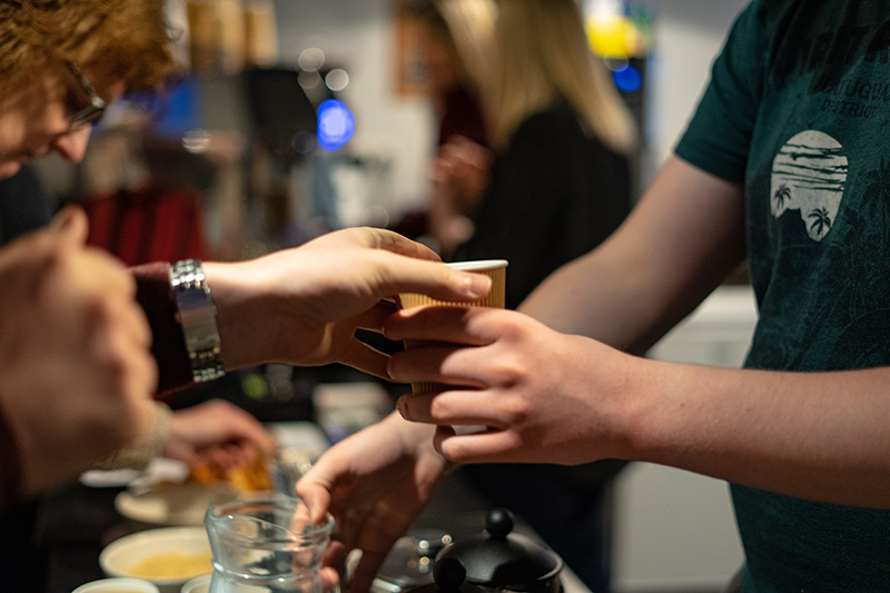 Person serving coffee<br />